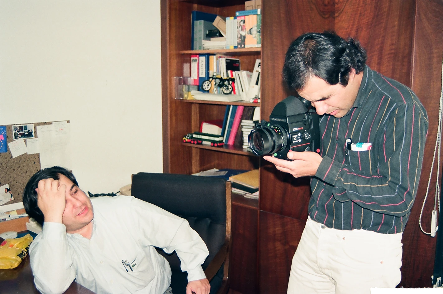 Photographer at work with a subject lying on the floor
